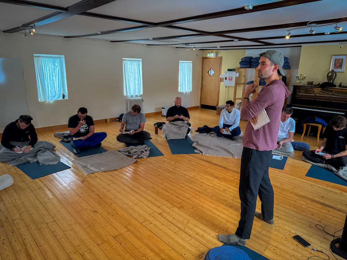 Jon Miksis facilitating a personal development retreat in Sweden where participants work through resistance patterns