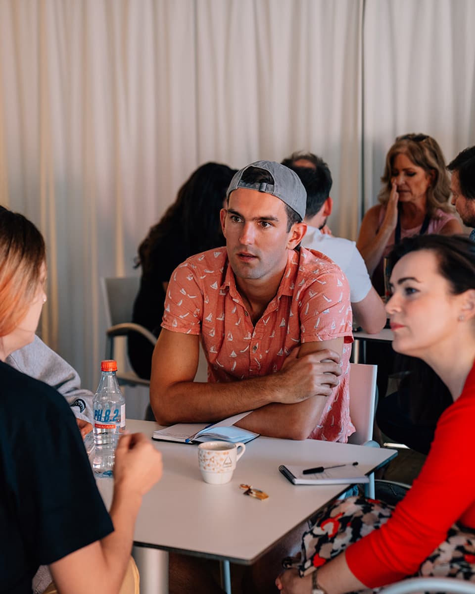 Jon Miksis facilitating a workshop with digital nomads about resistance patterns and personal change